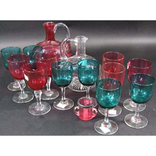 1175 - A cranberry-tinted glass decanter and set of six goblets, a small cranberry glass match holder and s... 