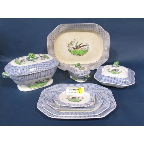 A Copeland Spode dinner service in the Exotic Pheasant pattern, with printed and infilled detail set within a blue starburst border comprising graduated plates, tureen and cover, meat plate, dinner plates, side plates, etc (60 pieces approx)