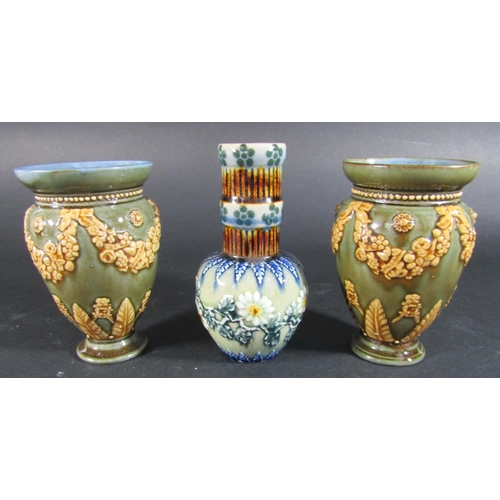 1076 - A pair of Doulton Lambeth oviform vases with repeating floral swag detail and acanthus leaves on an ... 