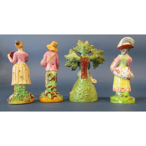 1081 - Four 18th century Staffordshire figures of three musicians, a flower girl (4)