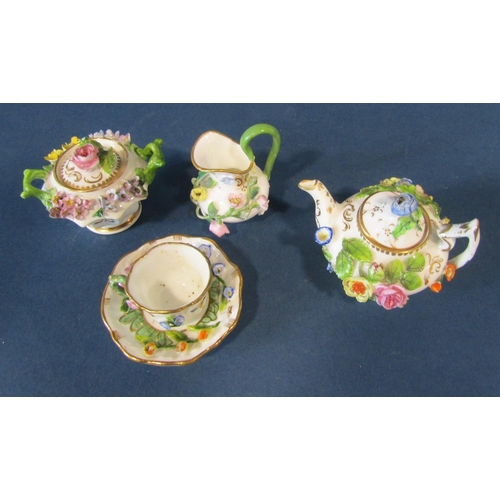 1086 - A miniature German porcelain (probably Meissen) tea service comprising teapot, sucrier and cover, mi... 