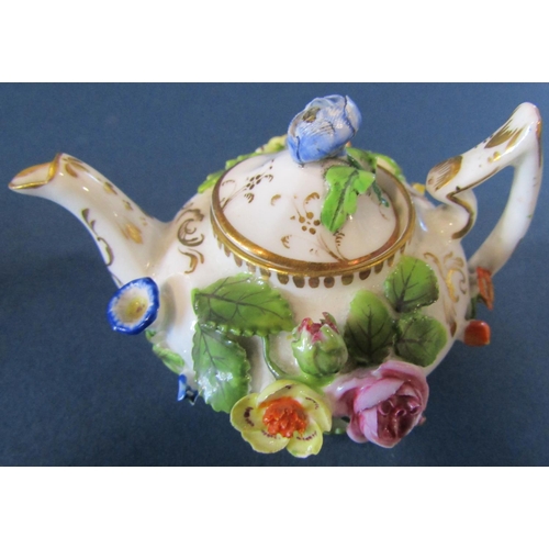 1086 - A miniature German porcelain (probably Meissen) tea service comprising teapot, sucrier and cover, mi... 