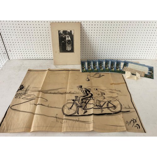 129 - A Group of items to include: 1939 cartoon signed 'Buzz' and dated lower right, ink on folded paper ,... 