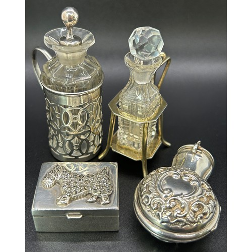 Three silver mini scent bottles two in stylish stands, one in a portable floral case, together with a sterling silver pill box with marcasite gems in the form of a Scotty dog to lid, mixed makers, weight 2.1 oz approx