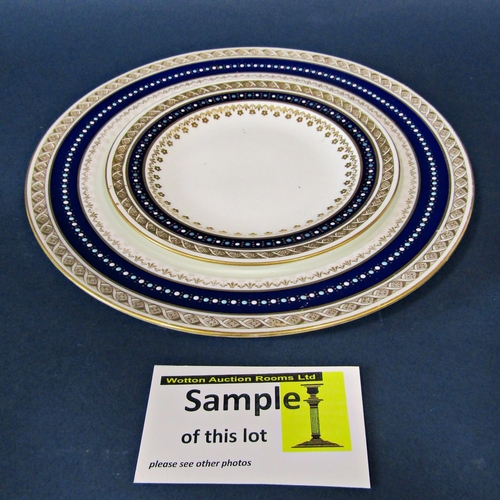 1133 - A quantity of Wedgwood dinner ware with a repeating blue and gilt banded colourway comprising meat p... 