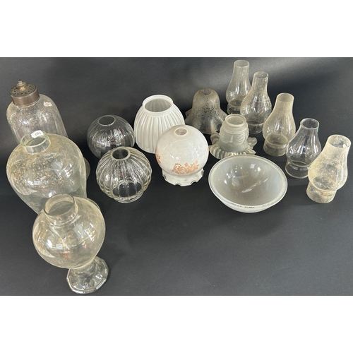 1193 - A large selection of Victorian oil lamps, glass fruits and shades, and other types of glass light sh... 