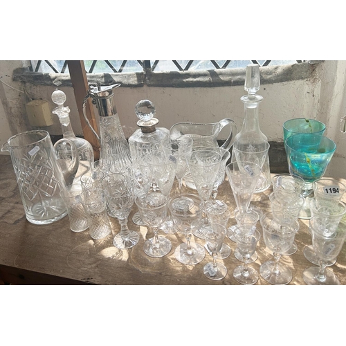 1194 - A collection of mixed glassware to include Victorian style engraved wine glasses, decanters, claret ... 