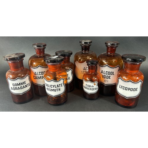 1205 - Eight French pharmacists jars in brown glass all with glass stoppers