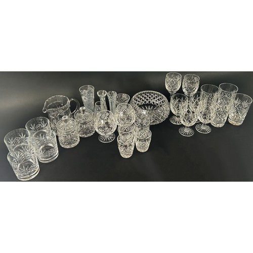 1203 - A near matching mostly Edinburgh cut crystal glass ware to include tumblers, wine glasses, brandy go... 