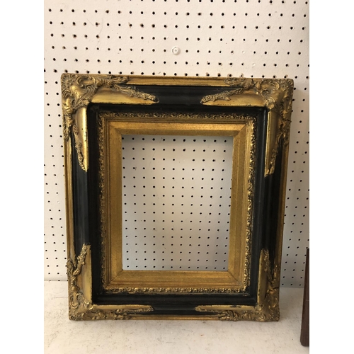 135 - Two c.19th century decorative gilt moulded frames, one with glass, one without, largest: 68 x 59.5 c... 