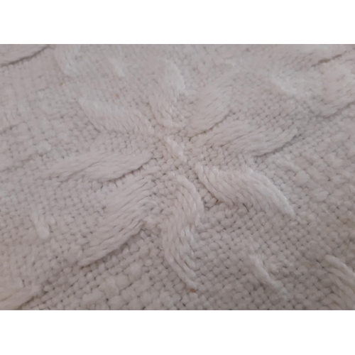 1830 - A pair of vintage cream fringed single bedspreads in patterned weave 150x230cm excl fringe, curved a... 