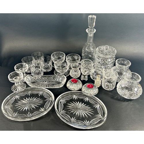 1204 - A large selection of cut glass ware including eight sorbet dishes, lidded jars decanters, candlestic... 