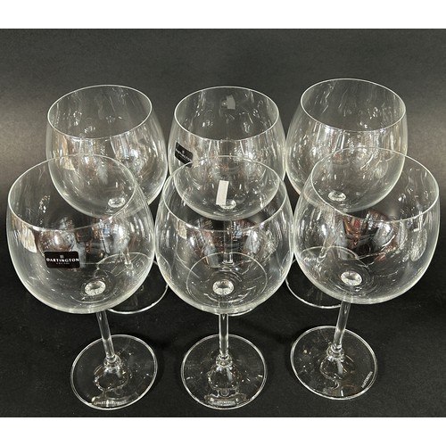 1201 - A boxed set of six Dartington Gym Coppa Party Glasses, a ships decanter, a further decanter, lotus s... 