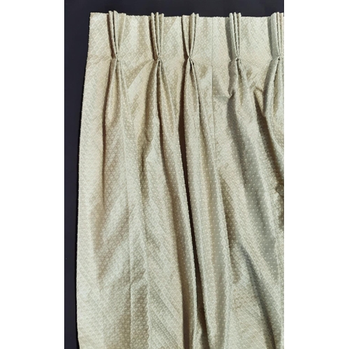 1823 - One pair of curtains in a green/ gold woven pattern, lined with triple pleat heading. Size per curta... 