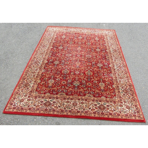 2753 - A Persian style machine-made rug, with a continuous floral pattern 170 x 240 cm