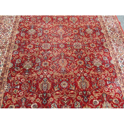 2753 - A Persian style machine-made rug, with a continuous floral pattern 170 x 240 cm