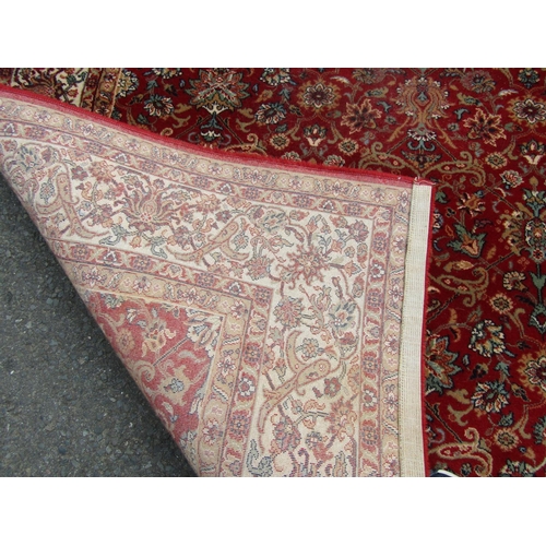 2753 - A Persian style machine-made rug, with a continuous floral pattern 170 x 240 cm