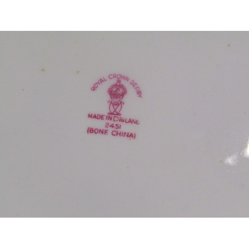 1011 - A pair of Royal Crown Derby Imari pattern dinner plates