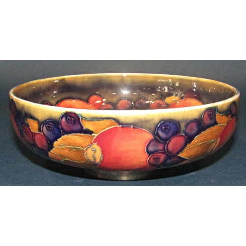 1016 - A Moorcroft bowl with pomegranate pattern, the foot with silver plated mount, together with a furthe... 