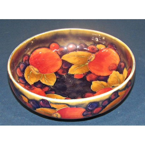 1016 - A Moorcroft bowl with pomegranate pattern, the foot with silver plated mount, together with a furthe... 
