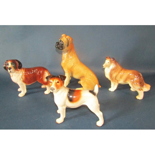 1028 - Four Melba ware dogs to include a Boxer, a Terrier, a Sheltie and a St Bernard