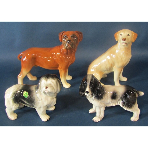 1035 - A collection of Melba ware animals including a Friesian Bull, Cow and Calf, together with a Labrador... 