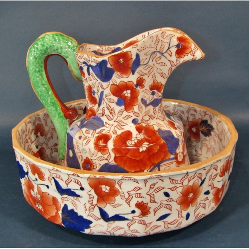 1046 - An ironstone jug and basin, the jug with serpent handle, together with a large Victorian meat plate ... 
