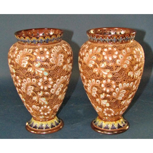 1049 - A pair of Doulton Lambeth oviform vases with pierced rims, and floral detail, three graduated Poole ... 
