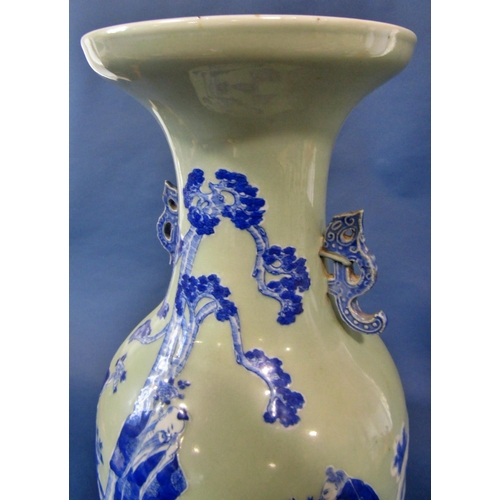 1060 - A large 19th century Chinese underglaze blue and white slip decoration celadon ground vase, sage and... 