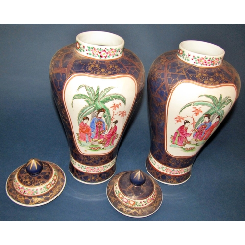 1063 - A pair of Chinese oviform vases and covers with character and foliate detail, set within blue and gi... 