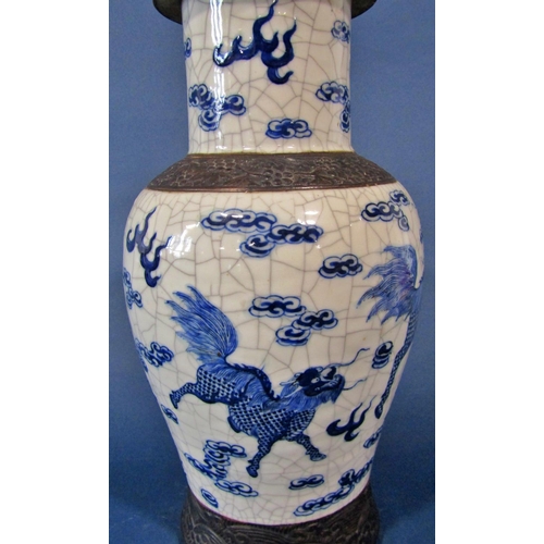 1085 - A crackle glazed vase with lion, cloud and other detail, with cover, 46cm high