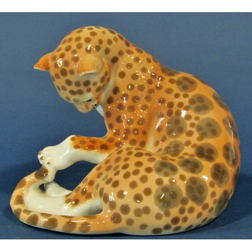 1089 - Four pieces of Russian ceramic wares including a recumbent giraffe, a leopard, a badger and a wren