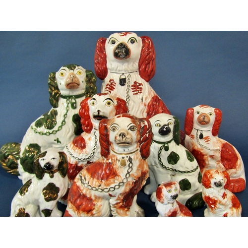 1102 - Nine 19th century spaniels, six with rust coloured patches, three in gilt, various sizes