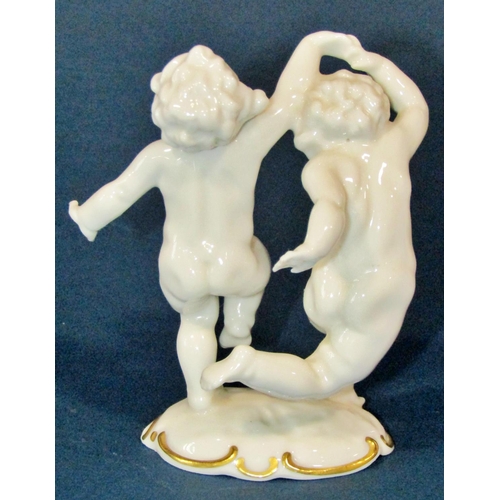 1120 - Kunstabteilung porcelain cherub in dancing pose, together with a further small 19th century group of... 