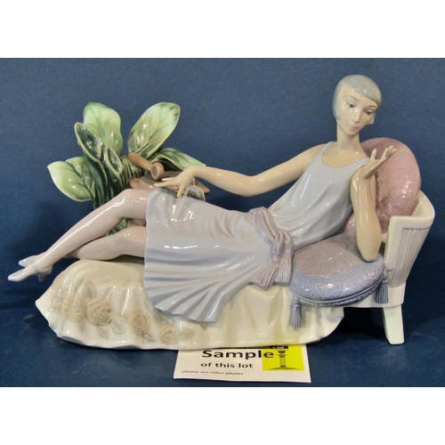 1141 - A collection of miscellaneous porcelain figures including a Lladro example of a lady reclining on a ... 