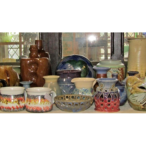 1159 - A large collection of studio pottery ware by Steven Marr, Pierre Brayford, Robert Tinnyynt and other... 