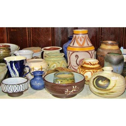 1160 - A large collection of studio pottery ware, various potters to include stemmed dishes, jugs and bowls... 