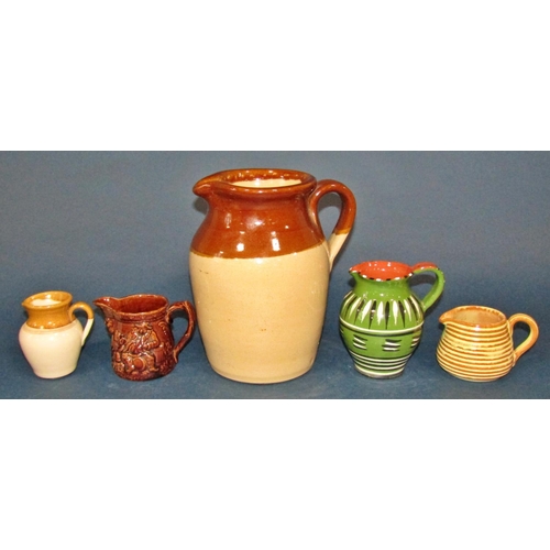 1190 - A large collection of Poole Pottery ware in green with mushroom coloured examples to include coffee ... 