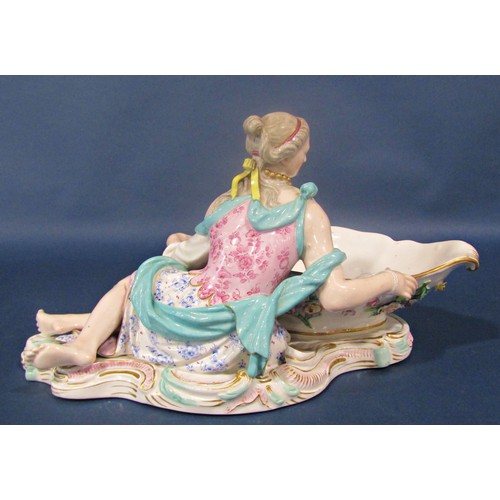 1015A - A large 19th century Meissen figural porcelain sweetmeat dish, modelled with reclining maiden, with ... 
