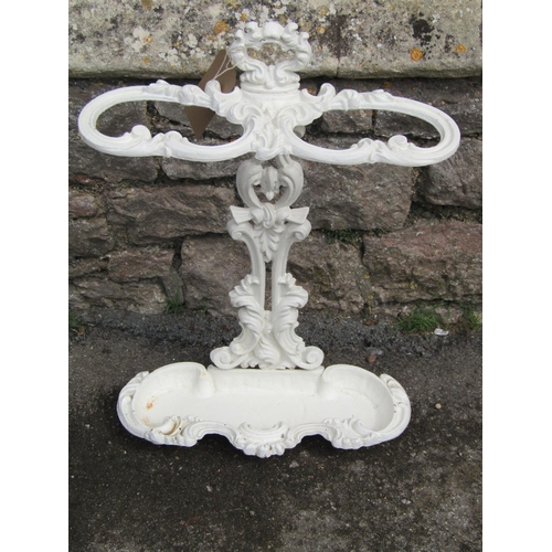 2071 - A cast iron stick stand with shaped and detailed outline and painted finish