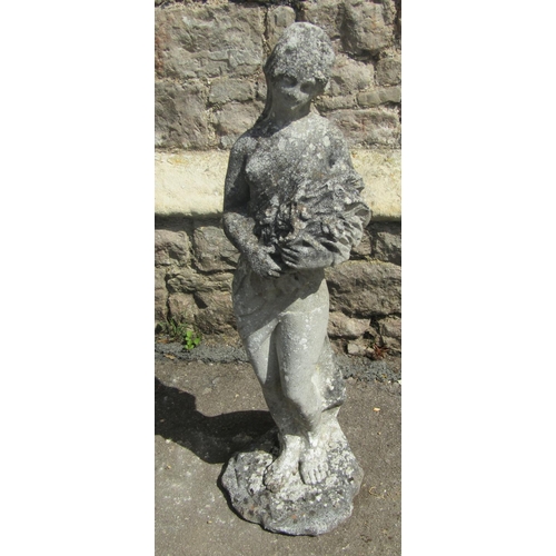 2087 - A weathered cast composition stone garden statue of a scantily classically draped flower maiden, 78 ... 