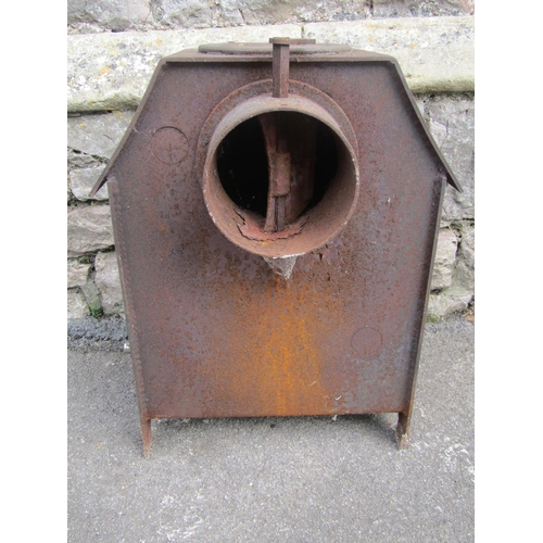 2100 - A cast iron wood/log burning stove, 62cm high x 60cm wide x 50cm deep