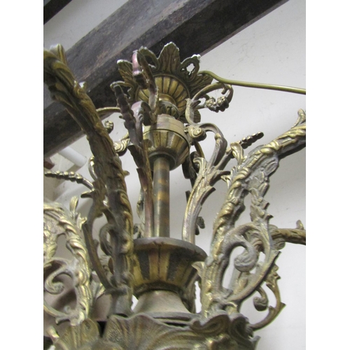 2102 - A heavy cast gilt metal hanging ceiling light with six swan neck acanthus branches, and further deco... 