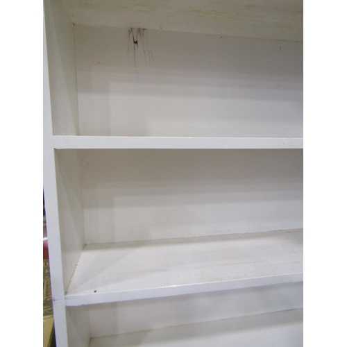 2113 - A painted floor standing open bookcase with fixed shelves 117cm w 206cm h