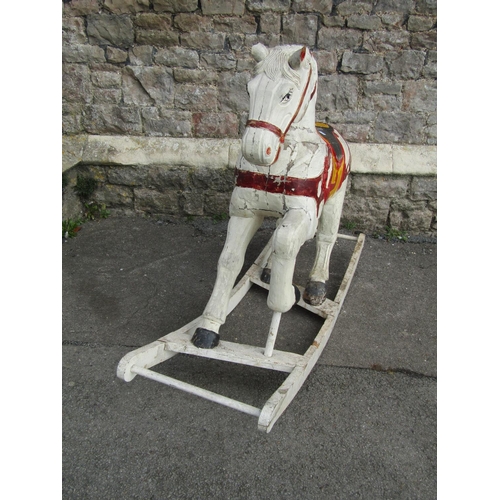 2114 - A antique continental carved wooden rocking horse with painted finish 138cm l x 100cm high (possibly... 