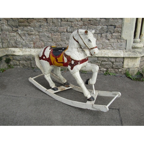 2114 - A antique continental carved wooden rocking horse with painted finish 138cm l x 100cm high (possibly... 