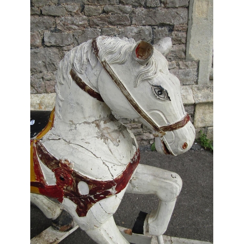 2114 - A antique continental carved wooden rocking horse with painted finish 138cm l x 100cm high (possibly... 