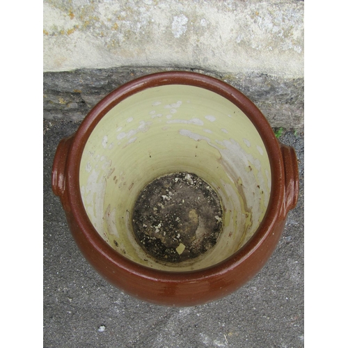 2117 - A terracotta storage jar, partially glazed with lug handles, 45cm high, together with six salt glaze... 