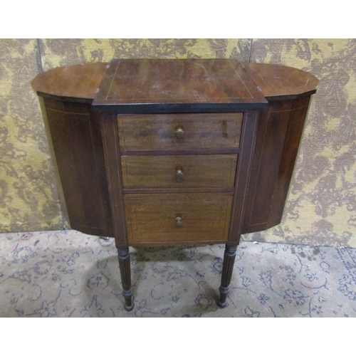 2234 - A 19th century mahogany sewing table fitted with three deep graduated frieze drawers, flanked by two... 