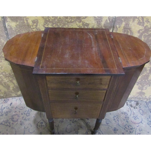 2234 - A 19th century mahogany sewing table fitted with three deep graduated frieze drawers, flanked by two... 